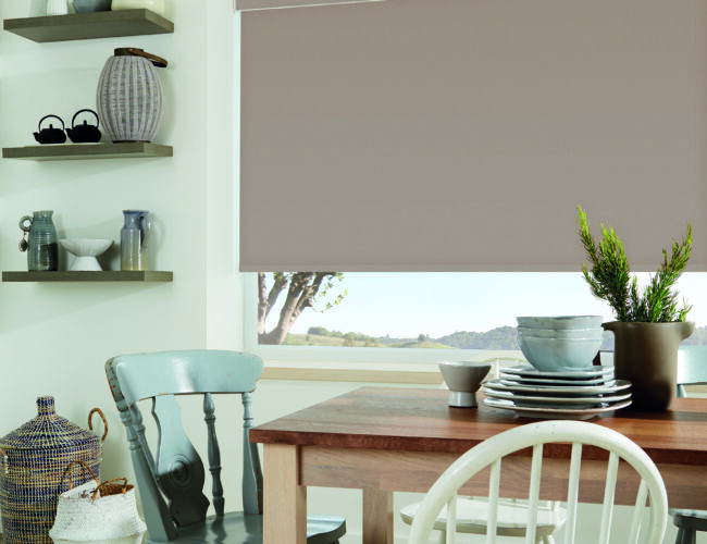 Carnival Clay roller blinds in a dining area
