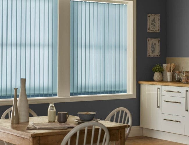 Blue vertical blinds for living room windows in cosy dining space